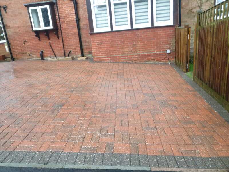 Brick driveway after being cleaned with pressure washer